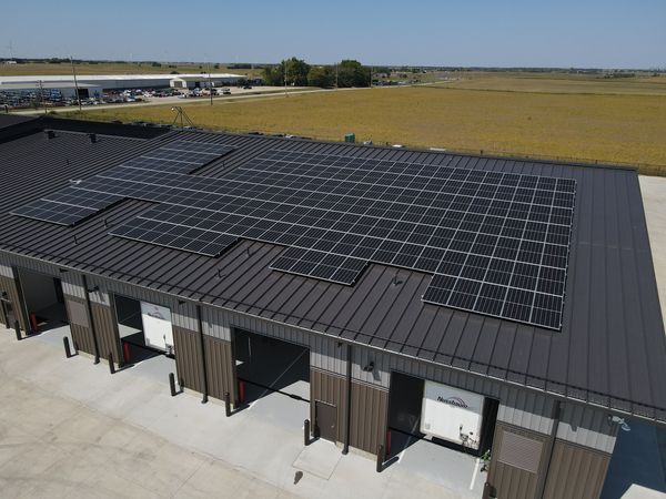 Rooftop solar array installed on commercial business in Hudson, IL by solar experts at Halo Solar